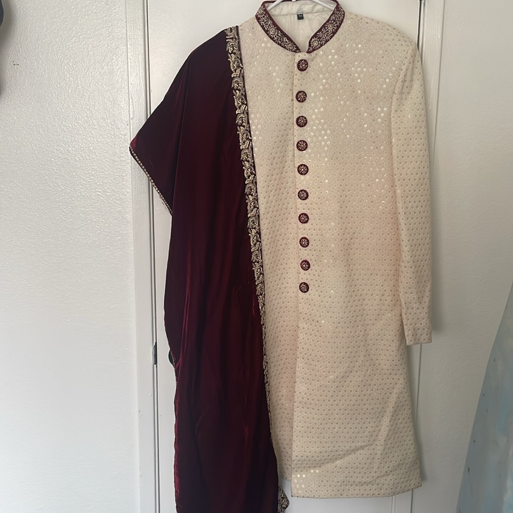 Burgundy and cream sherwani and shawl.